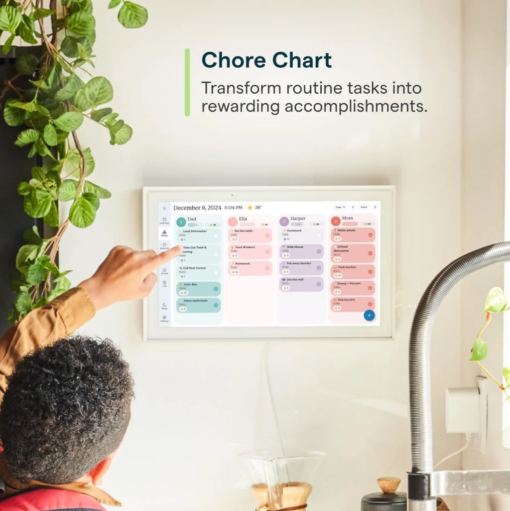 Person interacting with a digital chore chart on a tablet in a home setting.